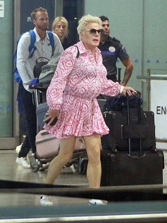 Eddie Izzard gives off perfect summer vibes with her pink floral dress while she vacations in Malaga